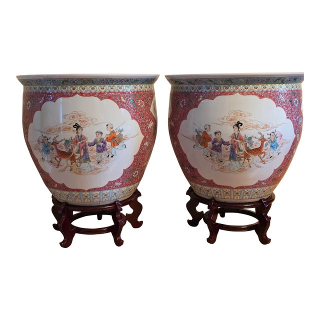 Mid-20th Century Chinese Ruby Ground Famille Rose Fish Bowls on Carved Stands - A Pair For Sale