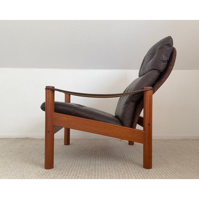 A pair of elegant Danish lounge chairs designed by Ebbe Gehl & Søren Nissen in the 1970s. These chairs feature solid...