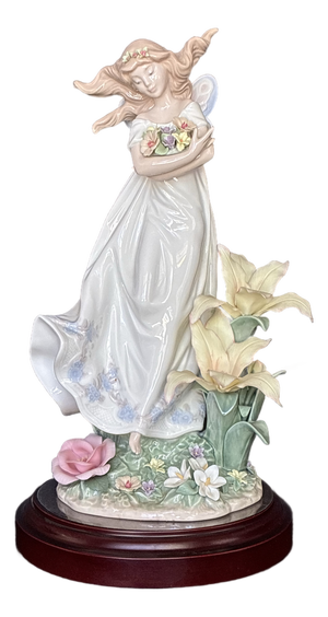 This Is a Limited Edition Lladró "Mystical Garden" Figurine,featuring a Fairy Holding Flowers.