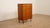 Danish vintage chest of drawers that stands out for its beautiful sleek design. The simple, clean yet playful handles on...