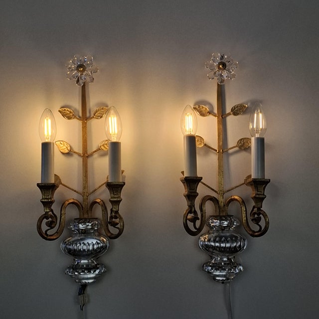 A beautiful set of two gold-plated wall lights from the renowned italian design house banci firenze. the wall lights are...