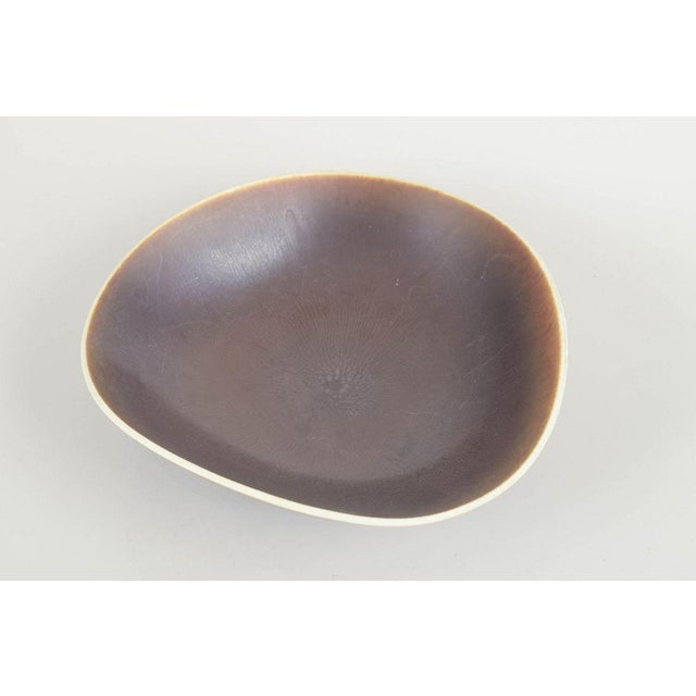 Berndt Friberg for Gustavsberg Studio Bowl, mid-20th century. Organic-shaped stoneware bowl with brown glaze and light...