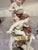 The Von Schierholz Handmalerei Dresden Cherub Putti flower Candle Holders are a pair of beautifully crafted porcelain...