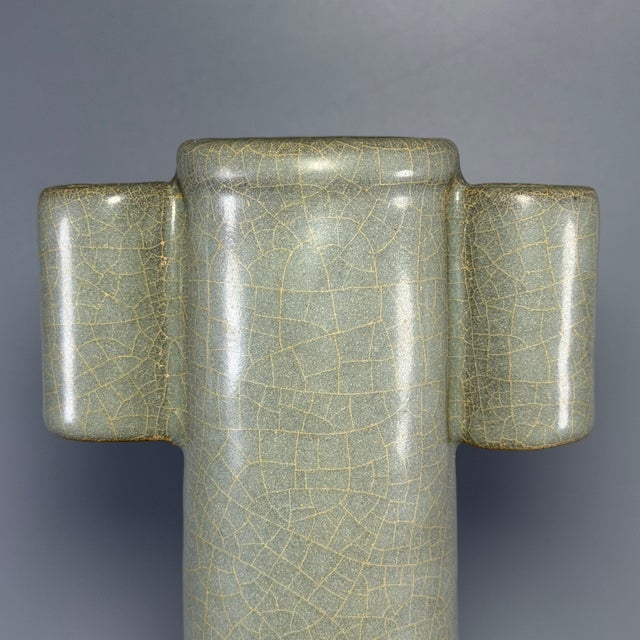 This antique Chinese Longquan celadon vase features elegant long neck and classic arrow ear (guan er) design on both...