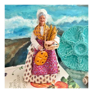 Late 20th Century French Clay Santon Sculpture of a Woman With Basket of Baguettes, Fish and a Loaf of Bread