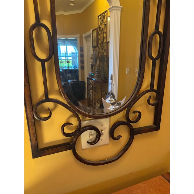 Lao g oval scroll in heavy iron wall mirror with open scroll work frame and oval mirror. Rustic aesthetic.