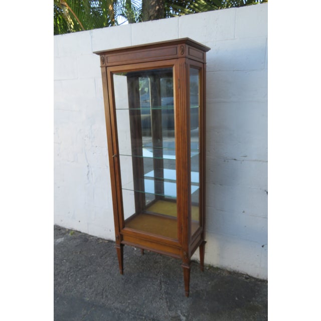 This Bookcase display Cabinet is made of wood, solid wood, maple, veneer, and glass. The Bookcase has a great Hollywood...
