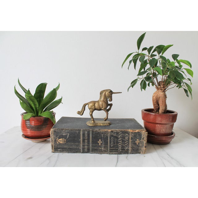 Vintage brass unicorn figurine. No maker mark. Patina.