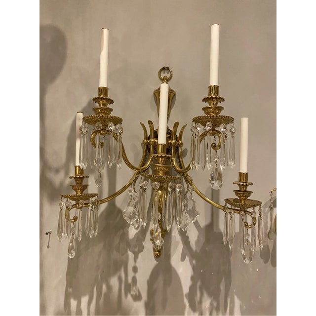 26” across 22” tall Transform your space with the dazzling elegance of this magnificent 5-light wall sconce, a true...