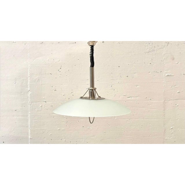 This elegant pendant light impresses with its clean, technically inspired design and high-quality combination of...
