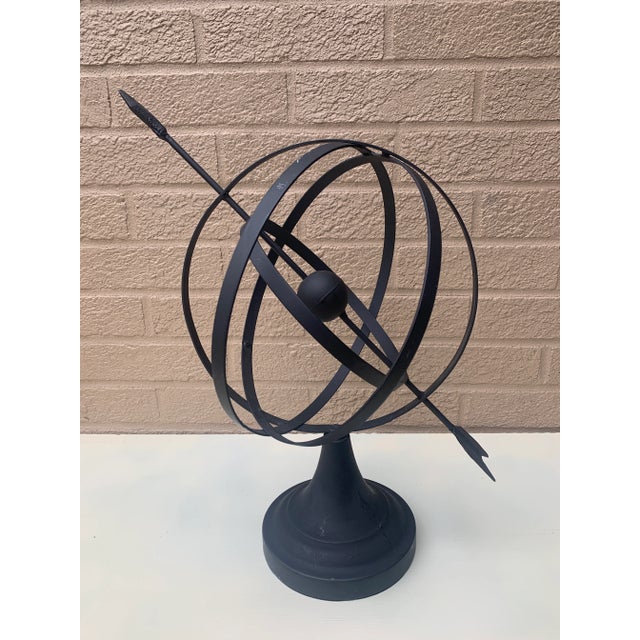A stunning vintage English country or Neoclassical style black iron garden armillary sundial USA, Late 20th Century...