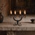 An exceptional mid-to-late 20th-century vintage hand-forged wrought iron 4-arm candelabra, masterfully crafted in Germany....