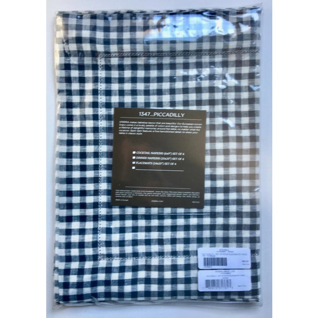 This is a beautiful set of four navy and off-white yarn-dyed linen check placements with hemstitched flanges made in Italy...