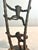 Mid-century inspired candlestick holder by Andrea by Sadek, featuring sculptural cast iron construction with playful...