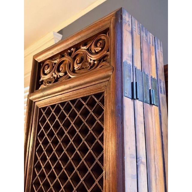 Hand carved and purchased in Tianjin, China, this folding wall features latticework that allows light and air to pass...