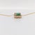 This beautiful pendant necklace features a 0.84 carat emerald cut Emerald gemstone with a halo of natural earth mined...
