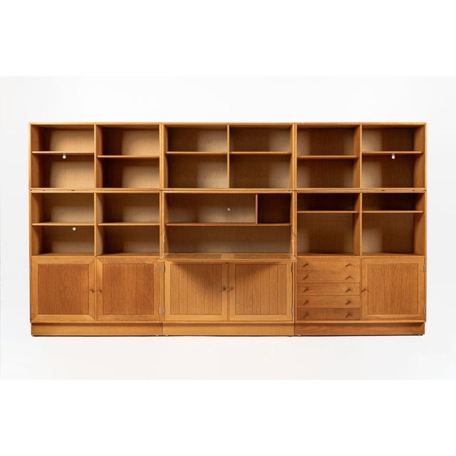 This set of three vintage mid century Danish modern oak wood bookcase display cabinets by Hansen & Guldborg was made in...