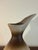 A beautifully sculptural mid-century modern studio pottery pitcher featuring an elegant asymmetrical spout and an organic...