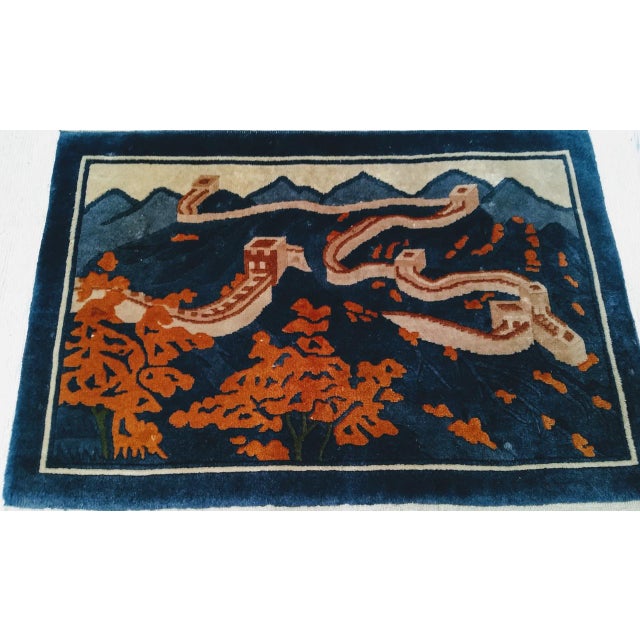 This vintage Chinese pictorial rug offers a breathtaking panoramic view of the Great Wall of China winding through...