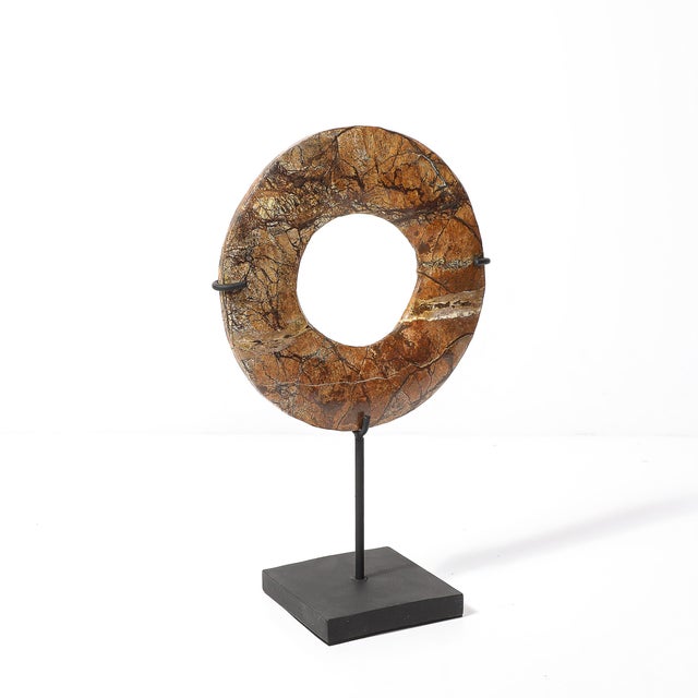 This exquisite red soapstone Bi disc is a remarkable artifact from Neolithic China, dating back to the 3rd millennium BC....