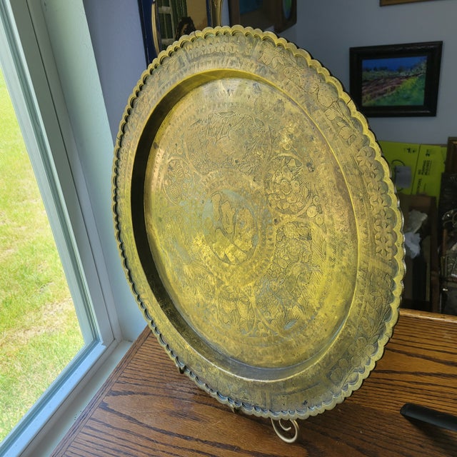 This vintage Oriental brass serving tray or wall decor piece from Hong Kong features a round shape with a diameter of 20...