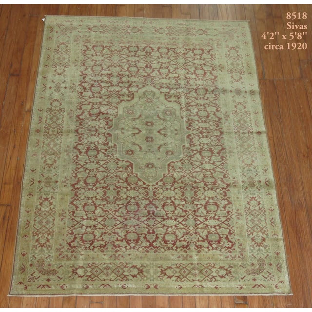 A persian tabriz or sivas rug from the early 20th century. tough to say