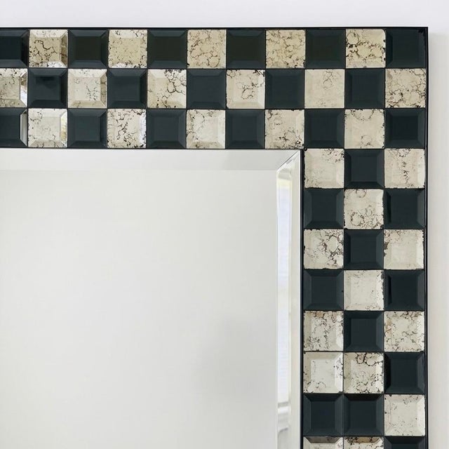 Black and silver checkerboard design mirror framed beveled mirror. Each checkerboard mirror piece is beveled, and silver...