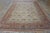 This antique Persian Mahal rug dated to circa 1925, features a beige ground with a wool composition measuring 9' 5" x 12'...