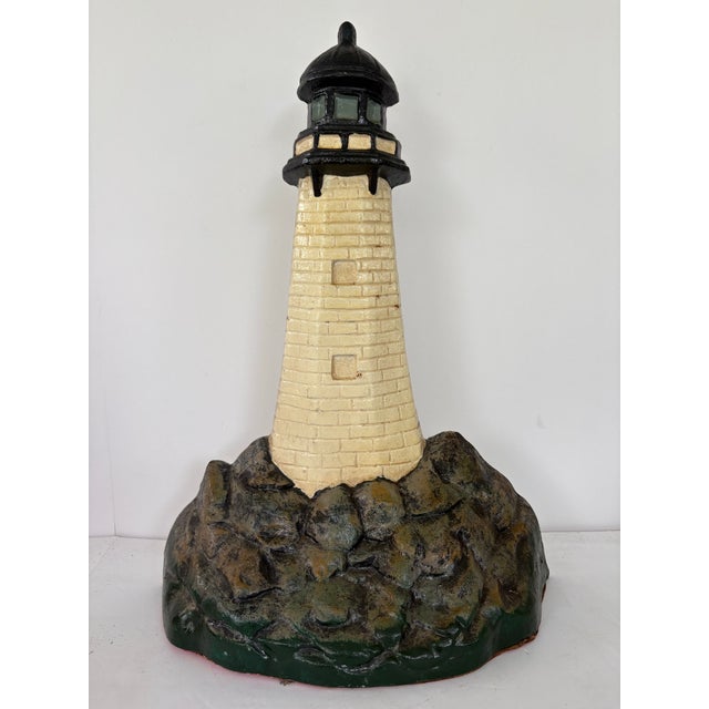 Bring a touch of nautical charm to your home with this vintage solid cast iron lighthouse doorstop. Cast in one single...