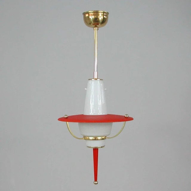 This unusual midcentury pendant was designed and manufactured in Italy in the 1950s. It features a red crinkle lacquered...