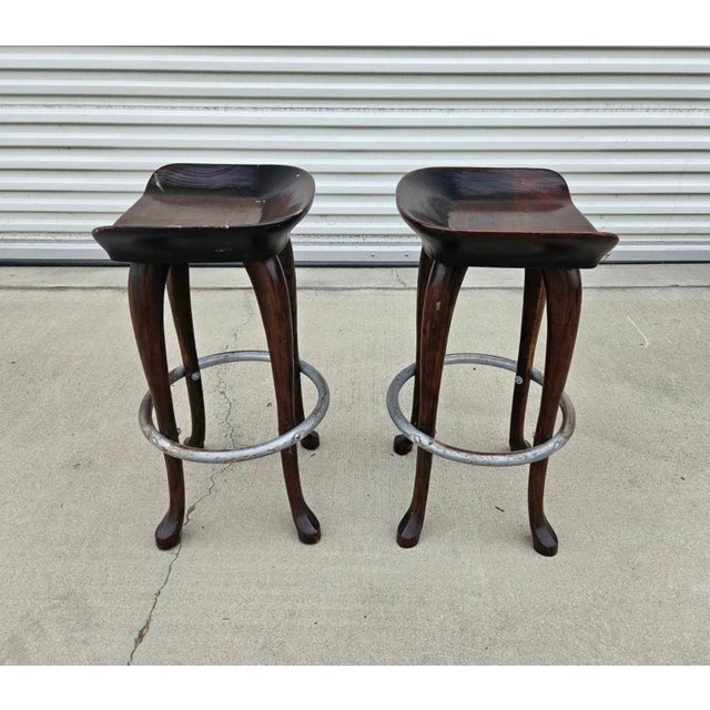 1979 Set of 2 Jean of Topanga hand carved counter stools. Made of solid hickory with Stylishly unique antique brass...