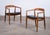 Elegant pair of Danish armchairs designed by Illum Wikkelsø for Niels Eilersen in the 1950s. Crafted from elm, the chairs...