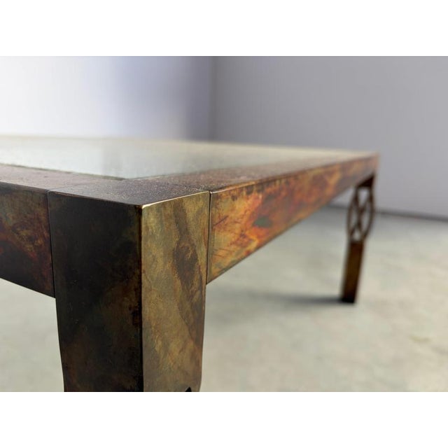Vintage coffee table with a golden/steel frame and a clear glass top. Cool 'twisted' design legs. Nice patina Good...