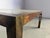 Vintage coffee table with a golden/steel frame and a clear glass top. Cool 'twisted' design legs. Nice patina Good...