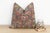 This 16-inch square pillow is a breathtaking fragment of Rajasthani heritage, repurposed from antique Banjara textiles...