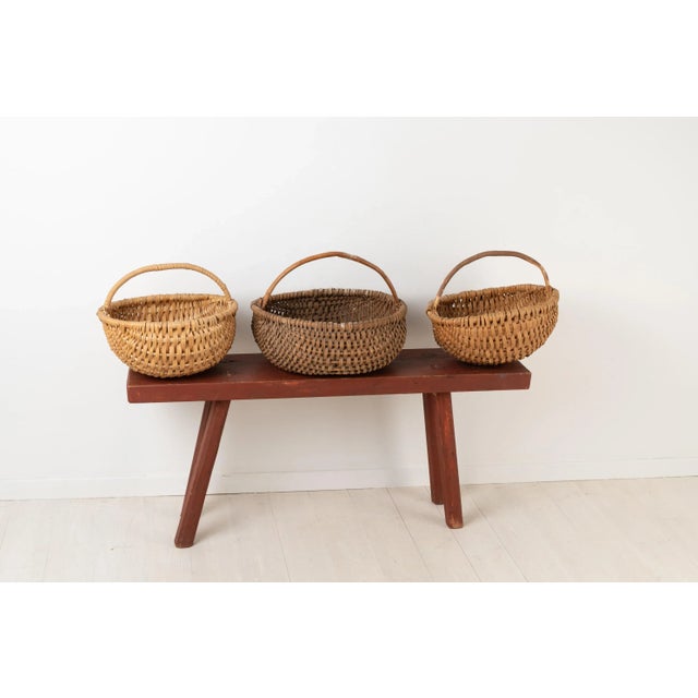 Antique bench in folk art. The bench is rustic and primitive and made circa 1820-1830. Made from painted pine with a solid...