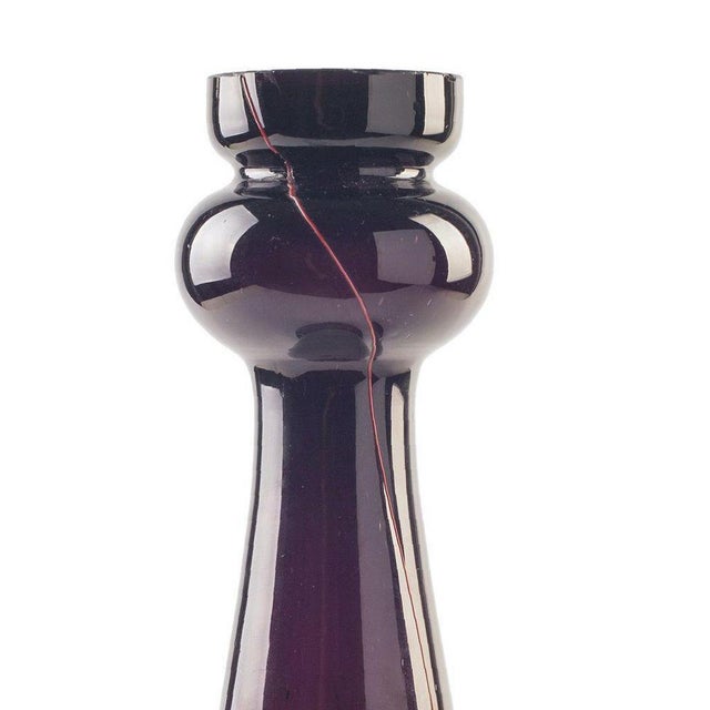 This Violet glass candleholder is a beautiful art glass piece realized by a Northern European manufacture during the...