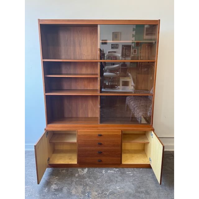 Proof that you actually can buy good taste: this vintage teak two-piece hutch is pure mid-century perfection. It pairs...
