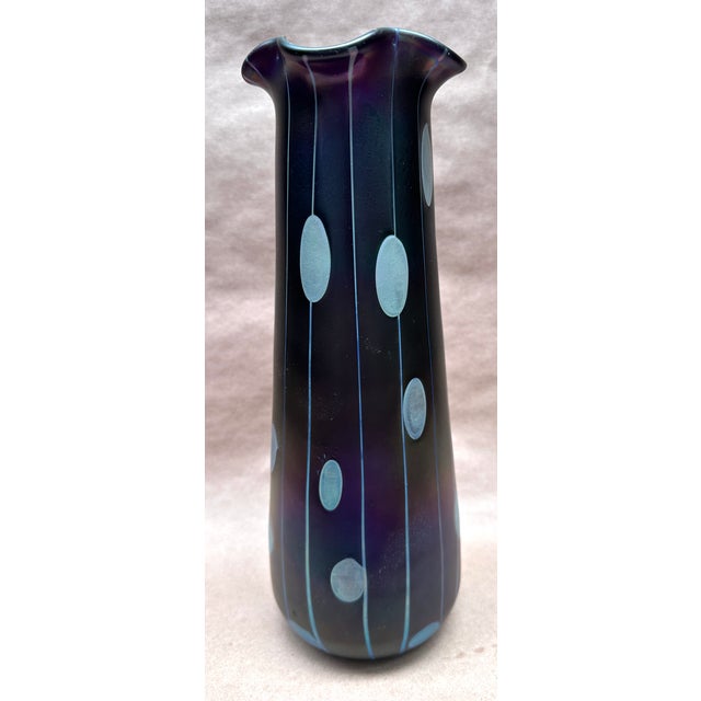 Here we have a tall beautiful Blue to purple iridescent vase by Loetz , the pattern is Streifen und Flecken made in the...