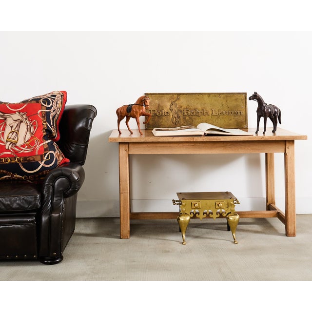 Perfectly aged and weathered cigar leather wing back reclining writers chair made in the manner, style, and size of Ralph...