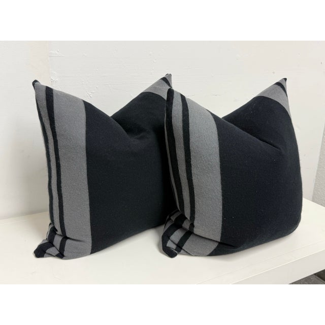 Design Plus Gallery presents a pair of Black + Gray Striped Pillows from Eastern Accents. These square pillows display...