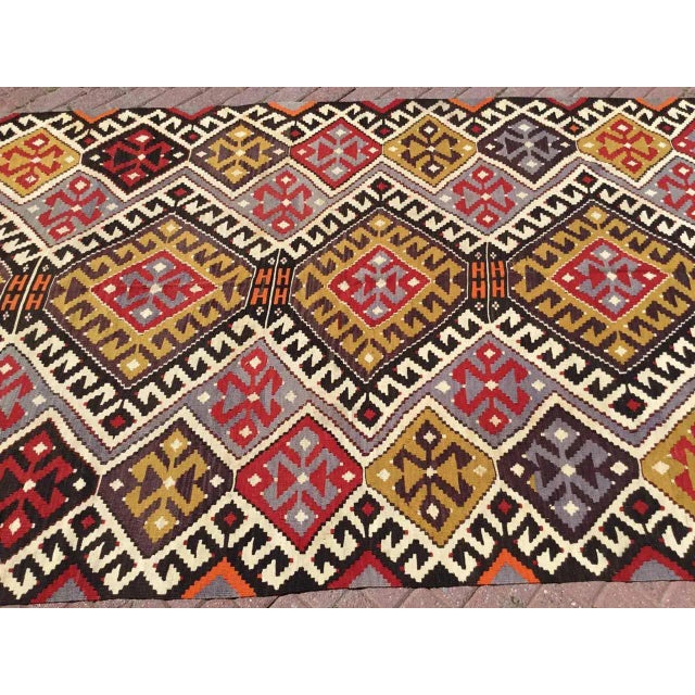 This beautiful vintage handwoven Kilim is in fabulous shape. It is approximately 70 years old, handmade of very fine...
