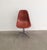 The chair features an embossed Herman Miller logo. The armchairs have the logo on the rubber pads under the seat, as shown...