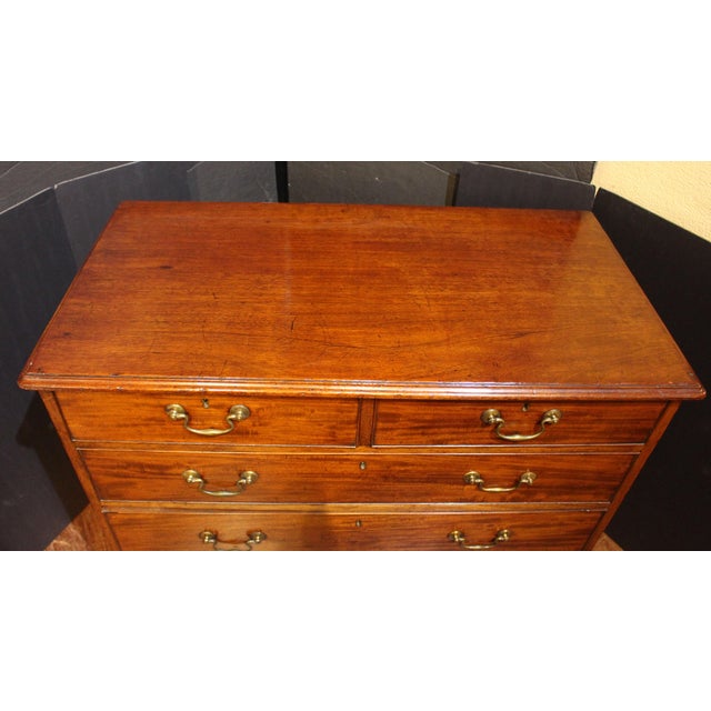 Circa 1780 George III chest of drawers, English. Straight front with 2 short over 3 long graduate drawers. Fine...