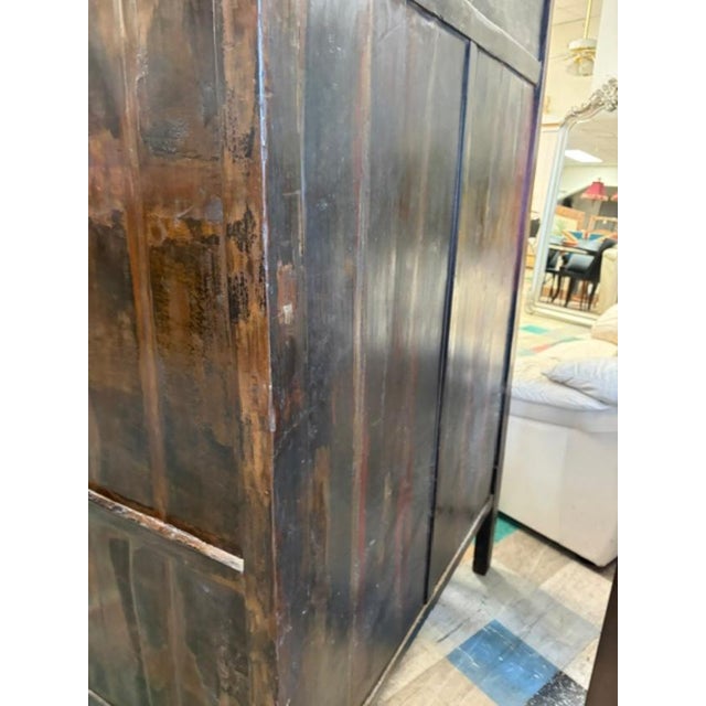 This antique Asian Chinoiserie cabinet is a remarkable piece that stands at 90 inches tall, featuring intricate lacquering...