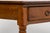 Sourced in Provence, France, this late 19th century French provincial fruitwood table reflects a restrained, functional...