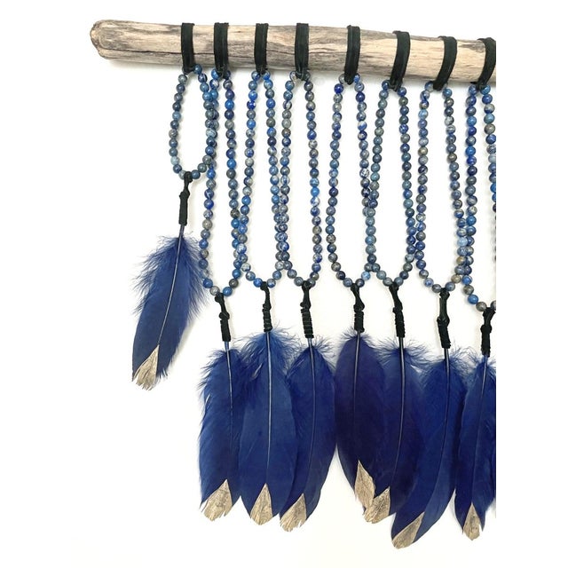 Thirteen Orbits Kristen Leigh Baker | 2024-2025 Medium: Hand-selected Lapis Lazuli crystals, ethically sourced deep blue...