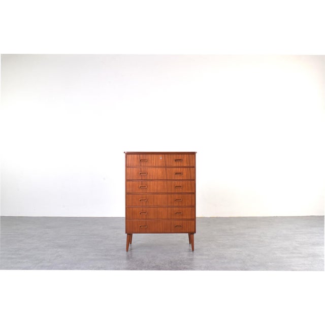 This teak chest of drawers was manufactured in Denmark in the 1960s. The furniture has been professionally and carefully...