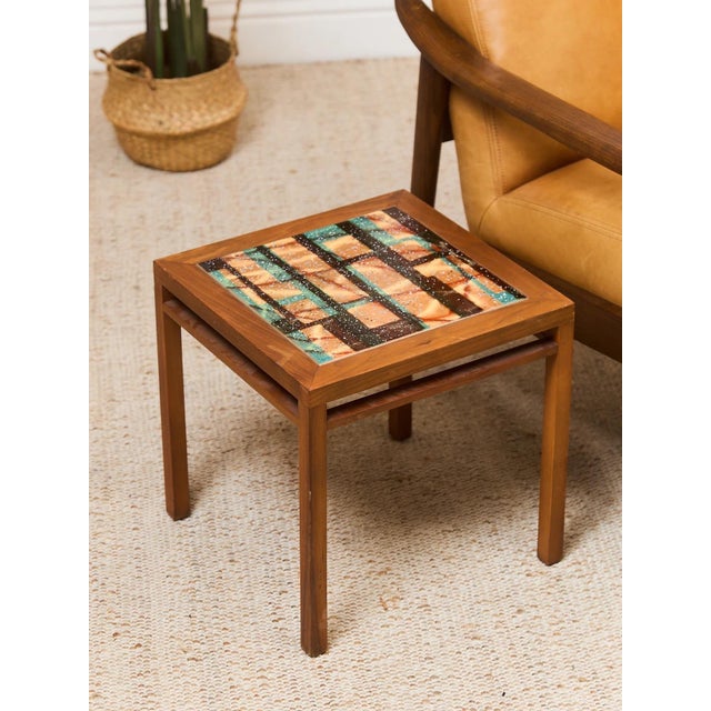 Discover the possibilities with the perfect end table. The perfect vintage find for showcasing photos, vases, lighting, or...