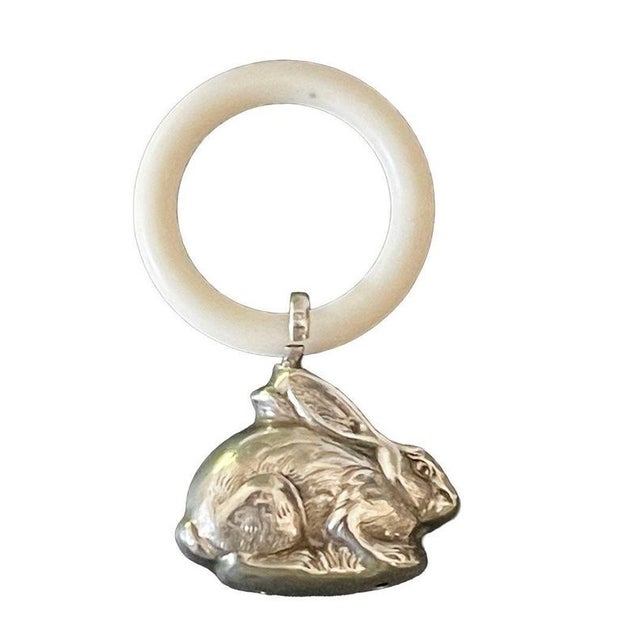 Silver baby rattle hare or rabbit, 1960s A silver baby rattle shaped like a hare, featuring a plastic teething ring. The...